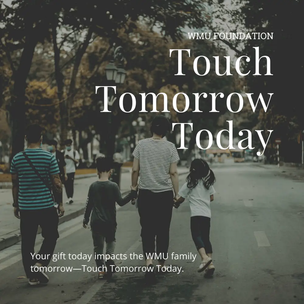 Family walking down the street holding hands with the words " Touch Tomorrow Today"